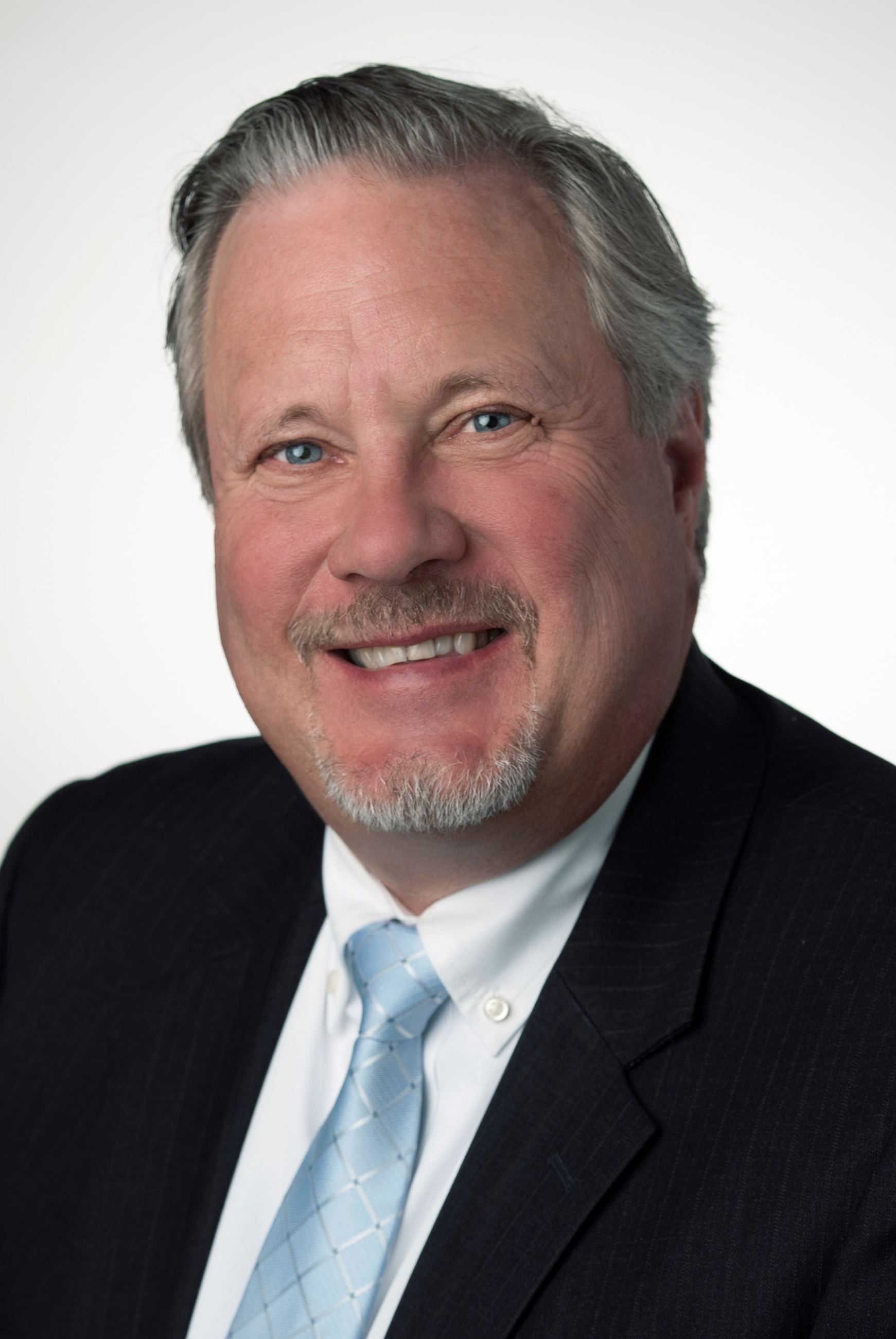 John Peterson in a suit and tie