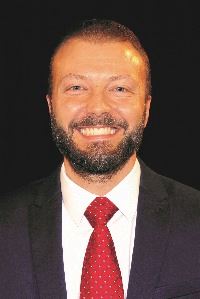 A man wearing a suit and tie