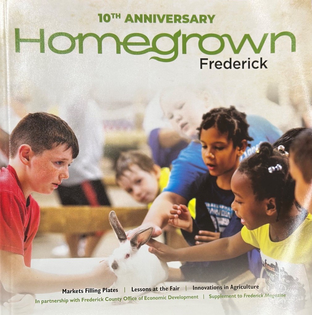 A magazine cover showing children petting a rabbit