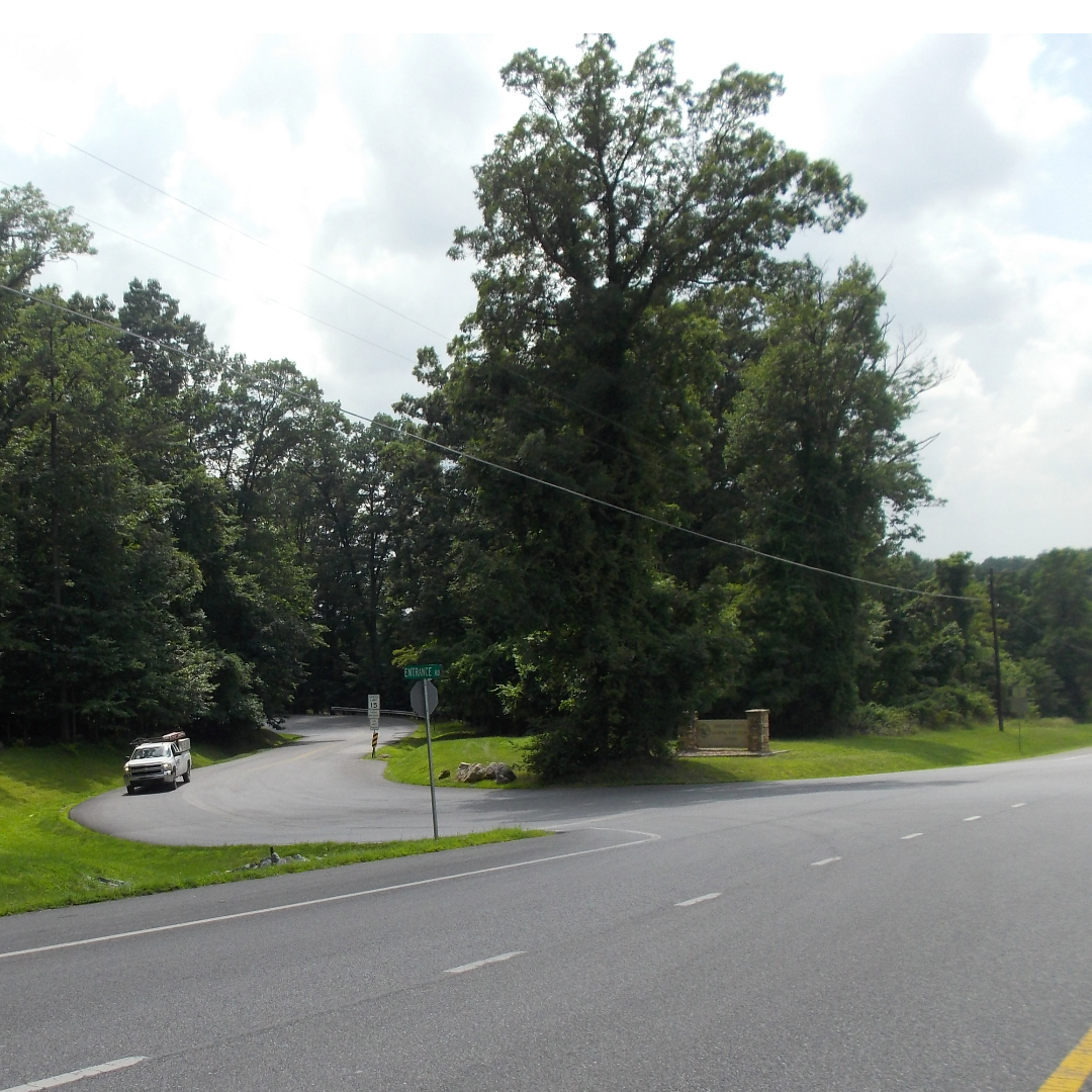 An intersection of a small road with a larger road