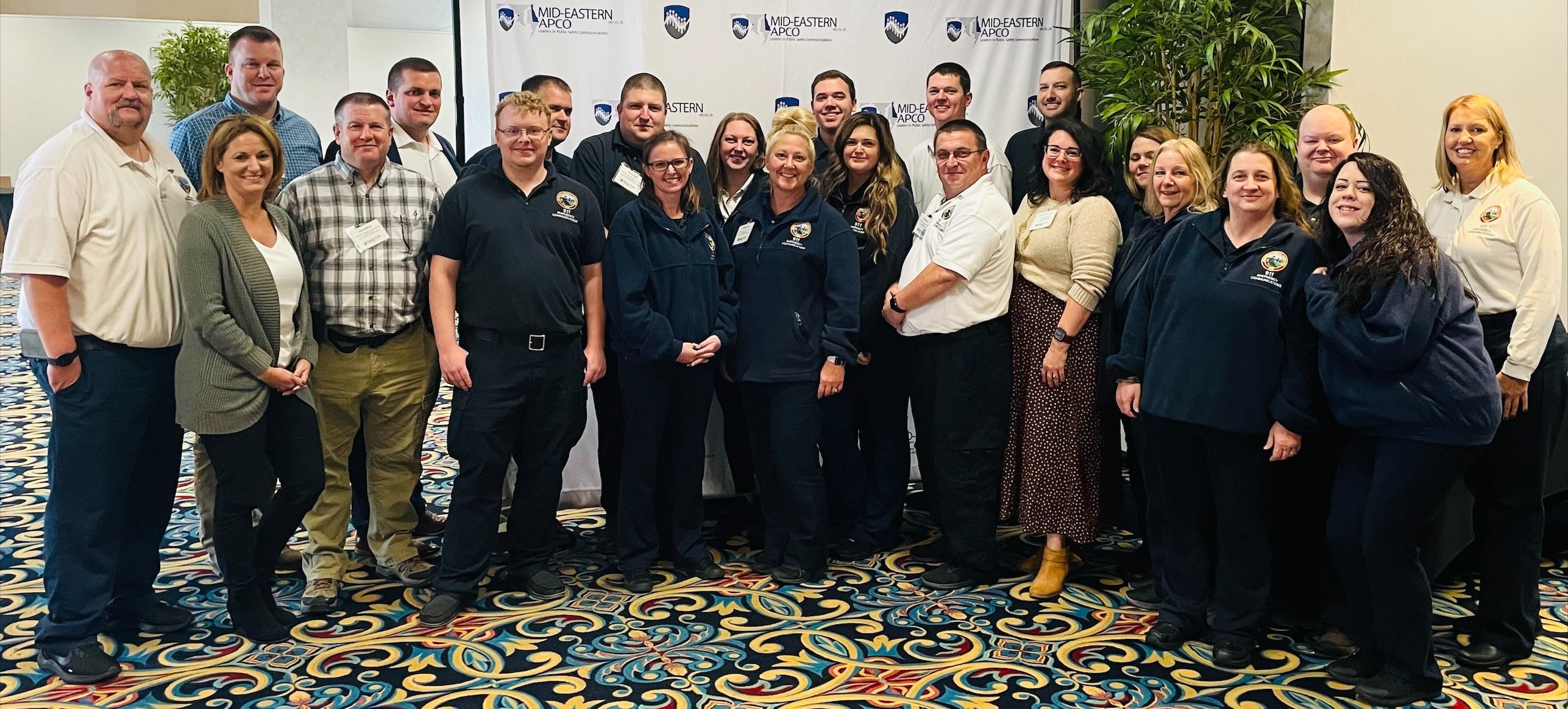 A group of people standing together indoors
