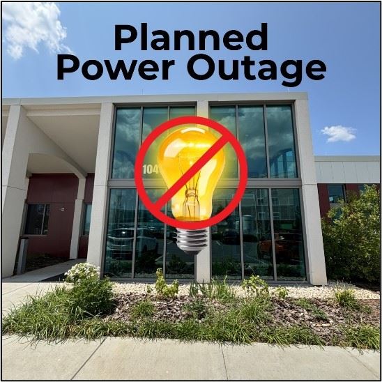 The exterior of a building with text that reads: Power Outage Planned.